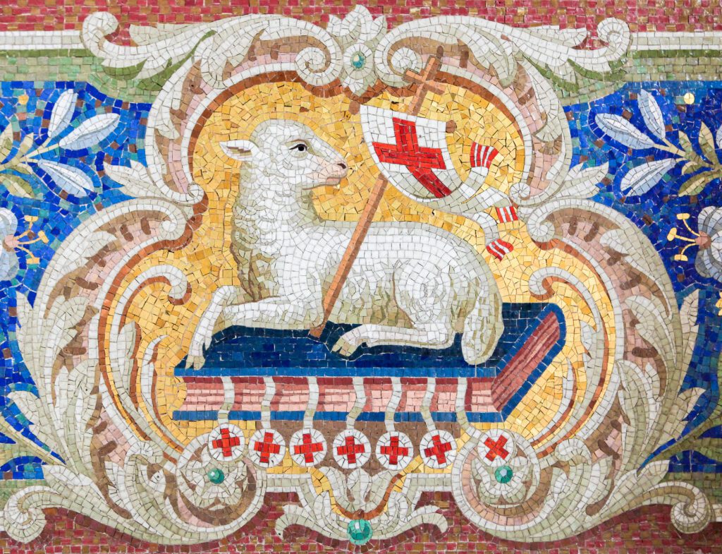 Mosaic of a lamb holding a cross banner.